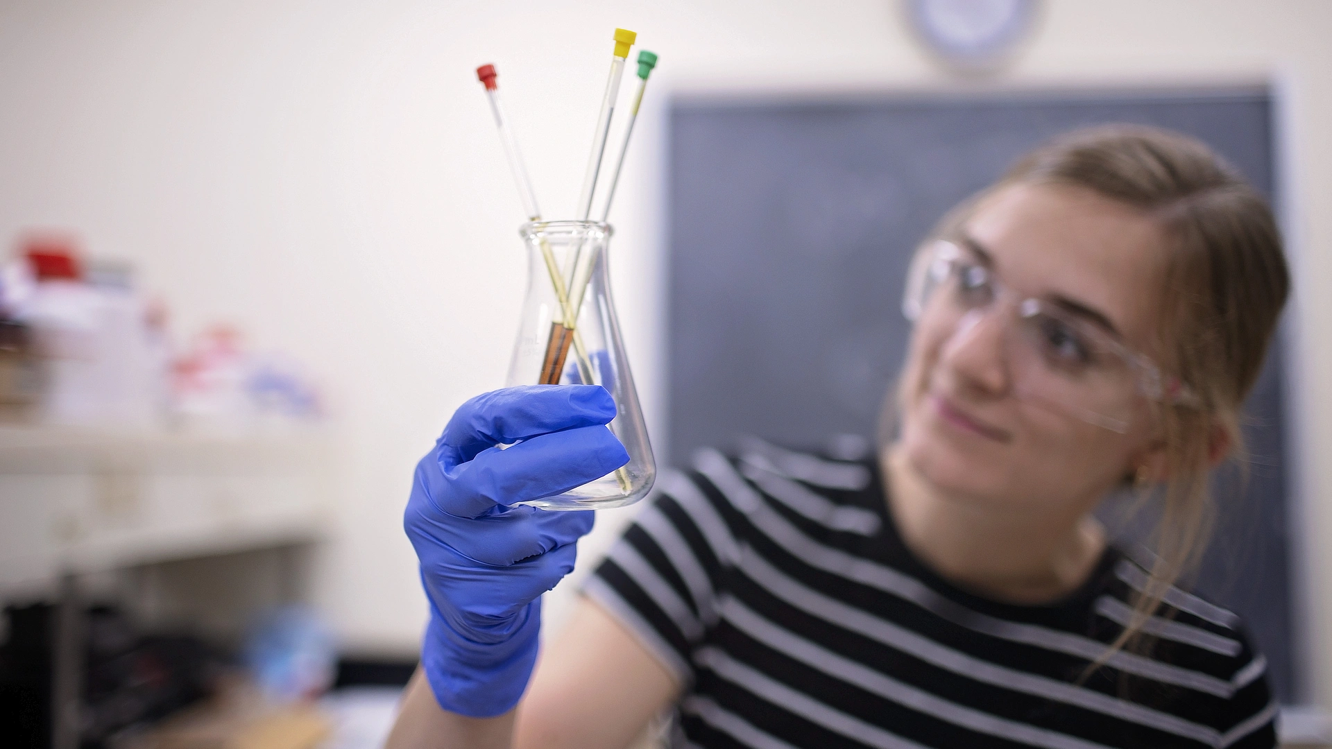 Chemistry Student Viewing Beaker