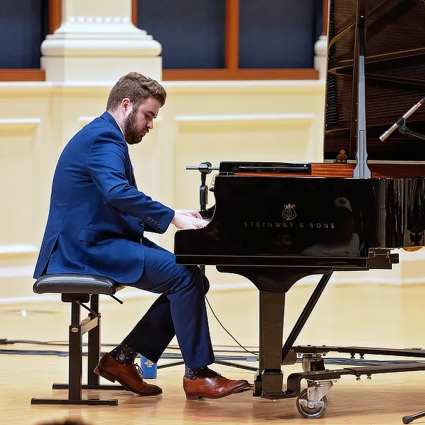Male Student Performing on Stage