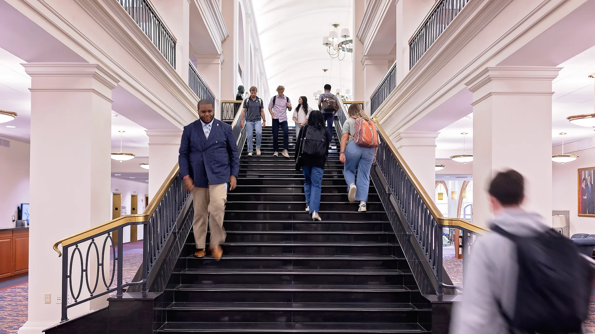Students Climbing Davis Library Stairs