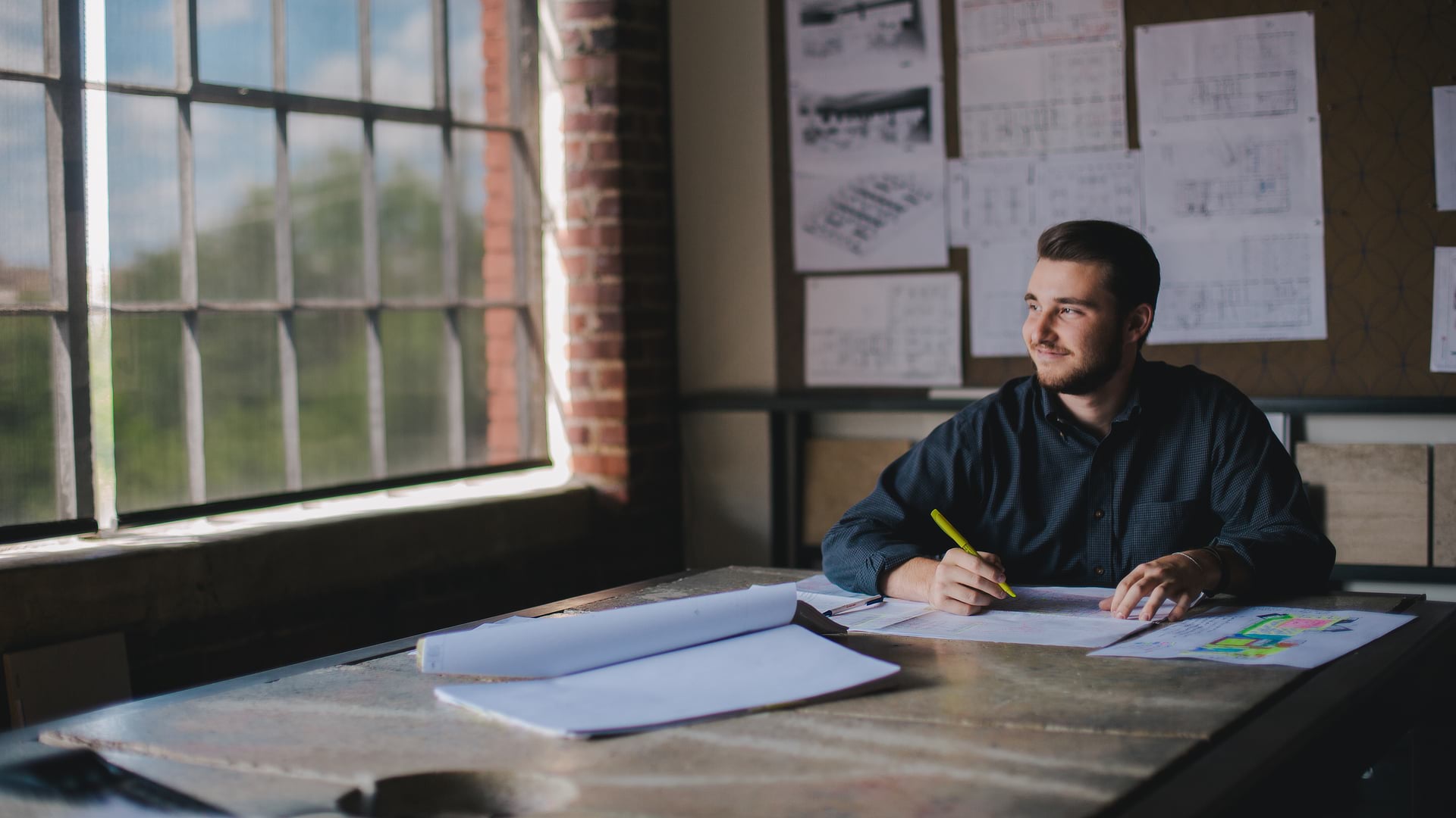 Male Student Working at Desk