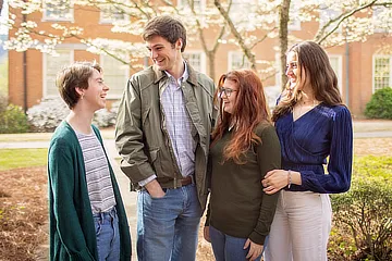 four arts and sciences students in the courtyard