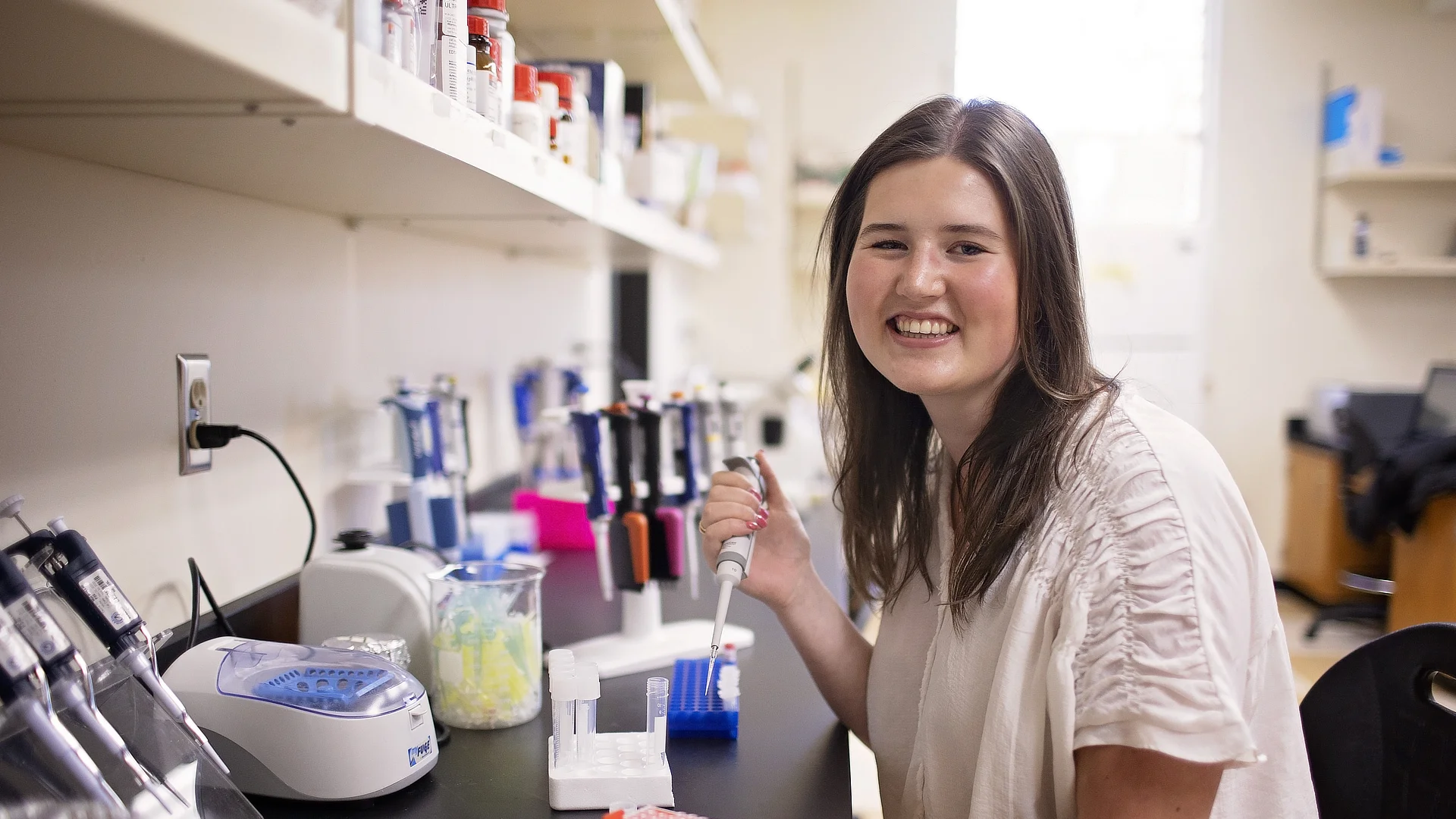 Environmental Female Student Working At Lab Desk