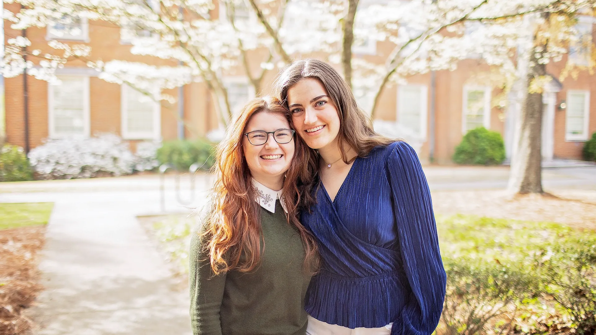 two female arts and sciences students in the courtyard