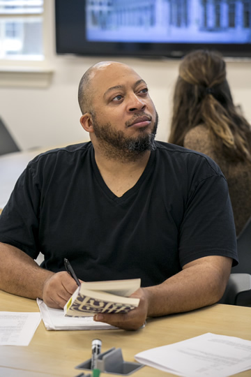 Male student listening to lecture