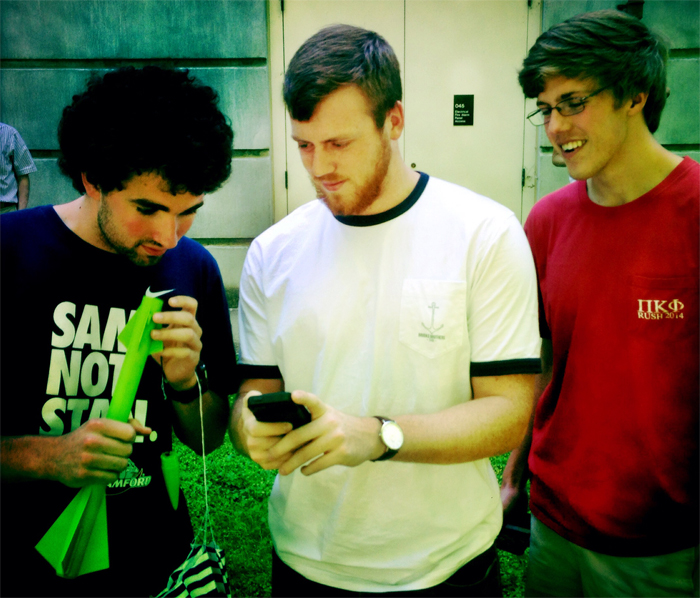 Students check their printed rockets