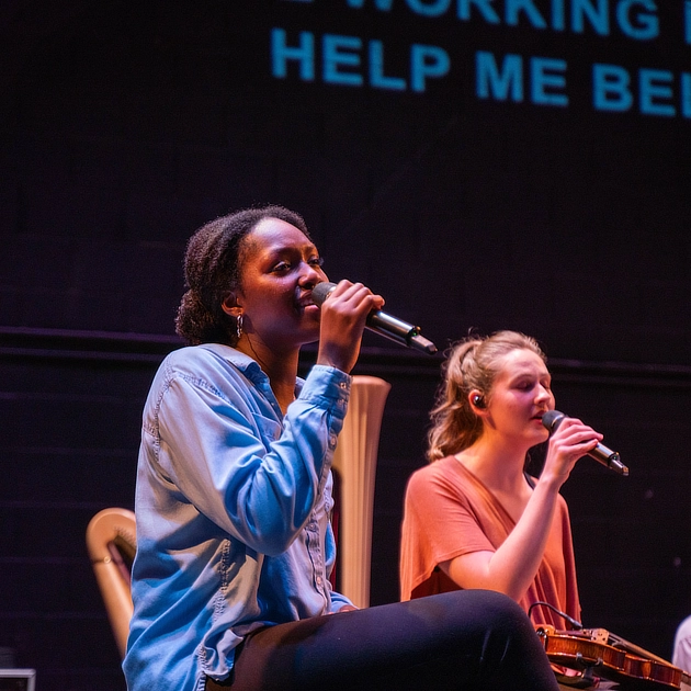 two young women singing