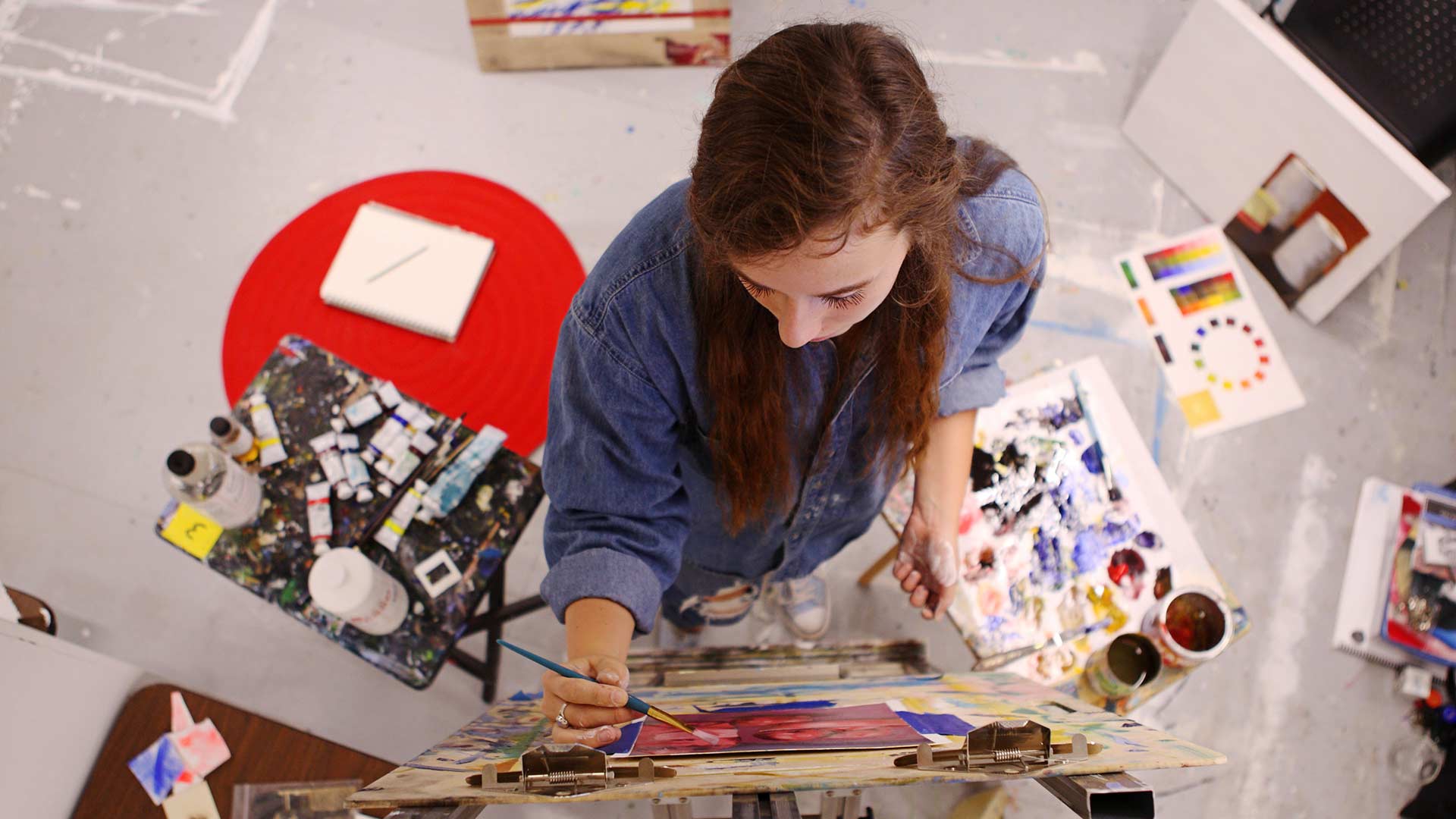 female student from above painting