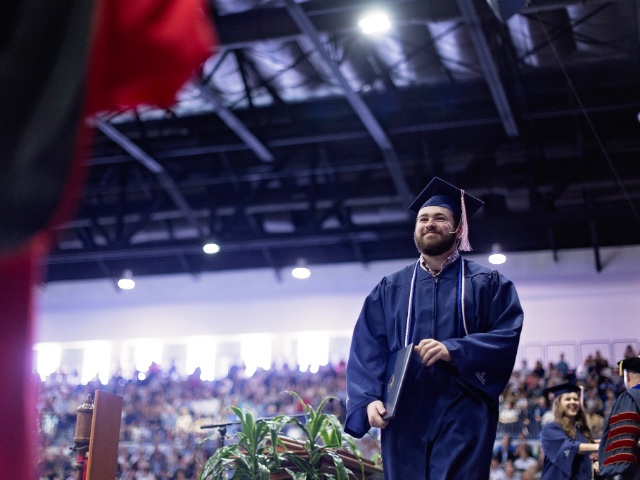 Briggs Cooper accepts bachelor of arts