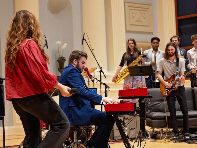 Briggs Cooper playing keyboard at his senior recital