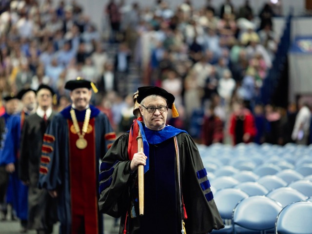 Don Sandley carries mace at commencement