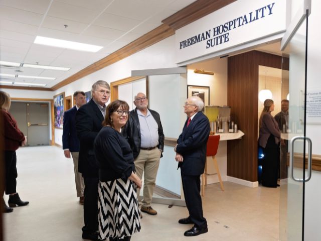Mike and Mary Anne Freeman welcome guests to hospitality suite