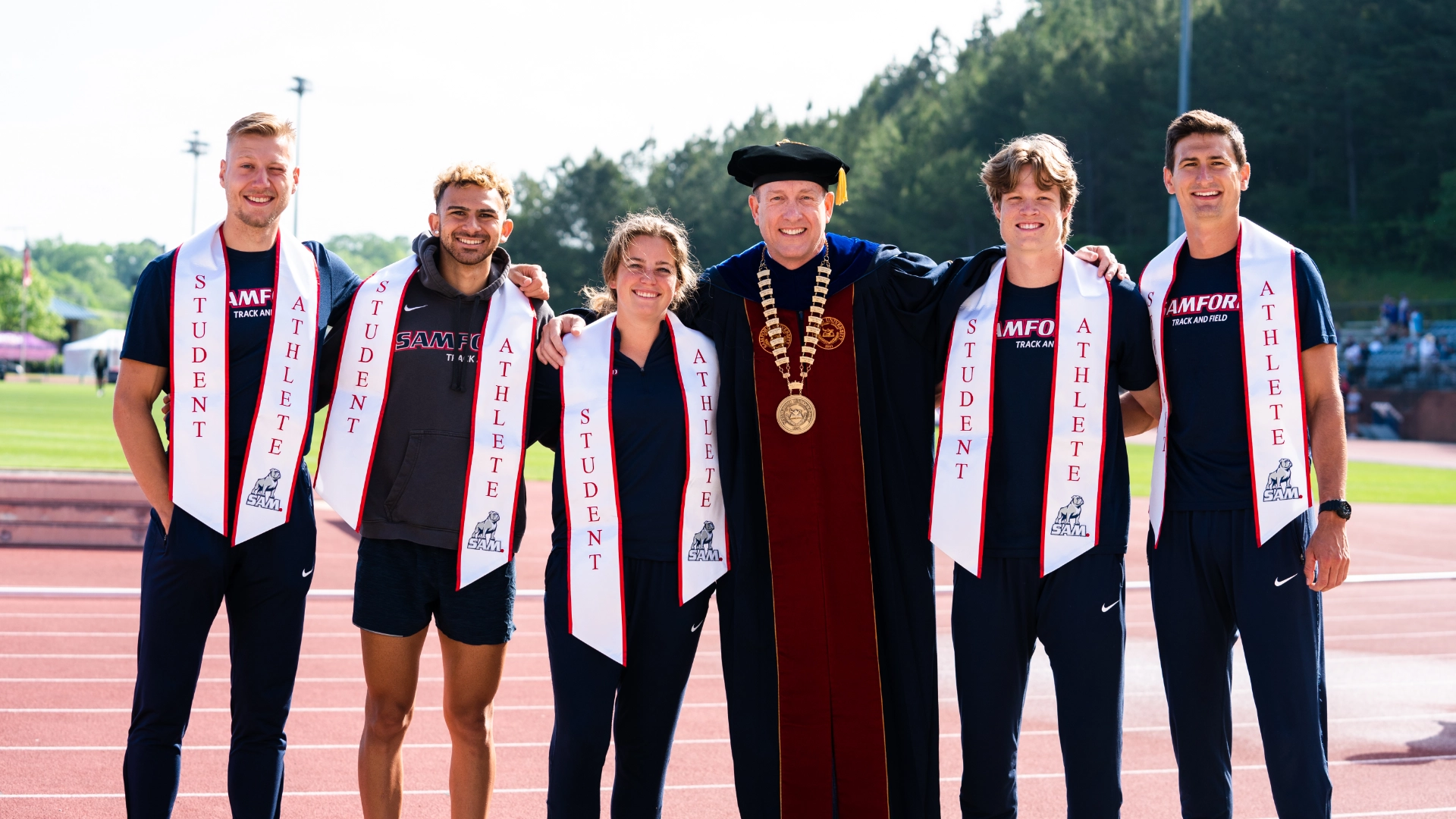 President Taylor with student athletes