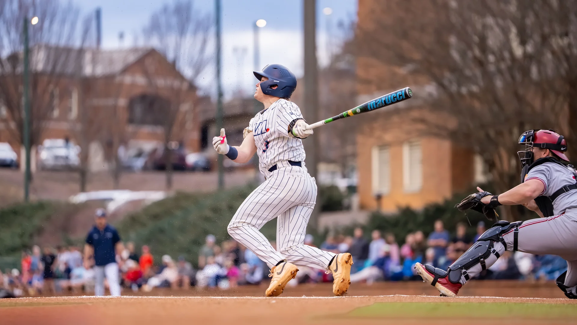 Samford Player Hitting a Baseball