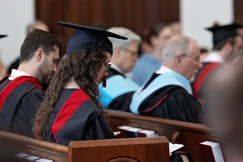 students praying in chapel
