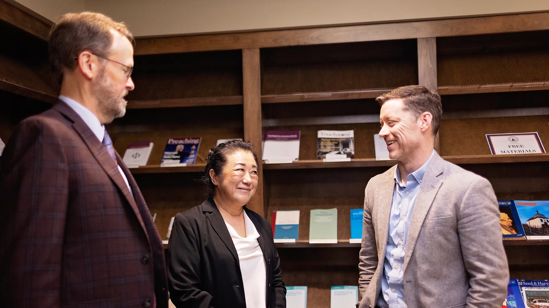 Three Faculty Members in a bookstore