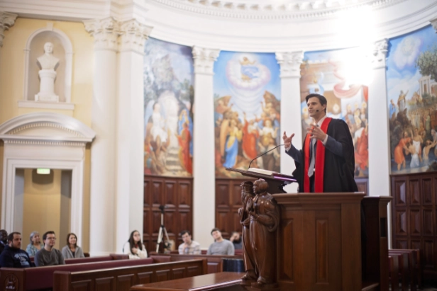 man preaching in Hodges chapel