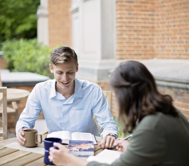 two divinity students studying