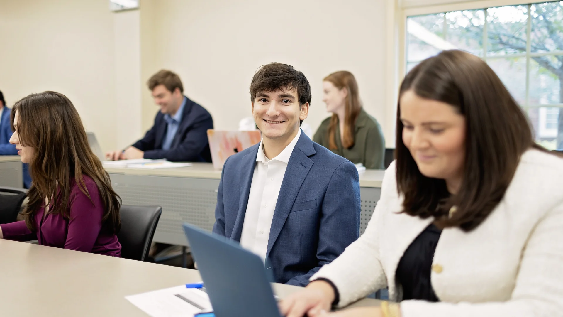 smiling male student in class