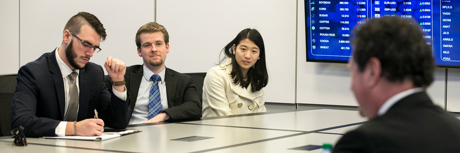 business students in meeting room header