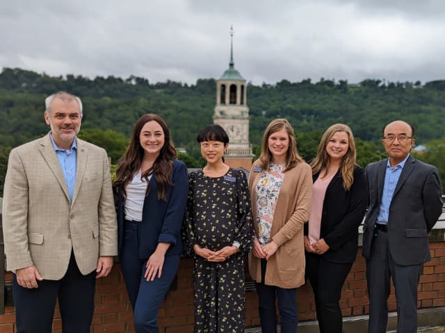 new brock faculty with dean