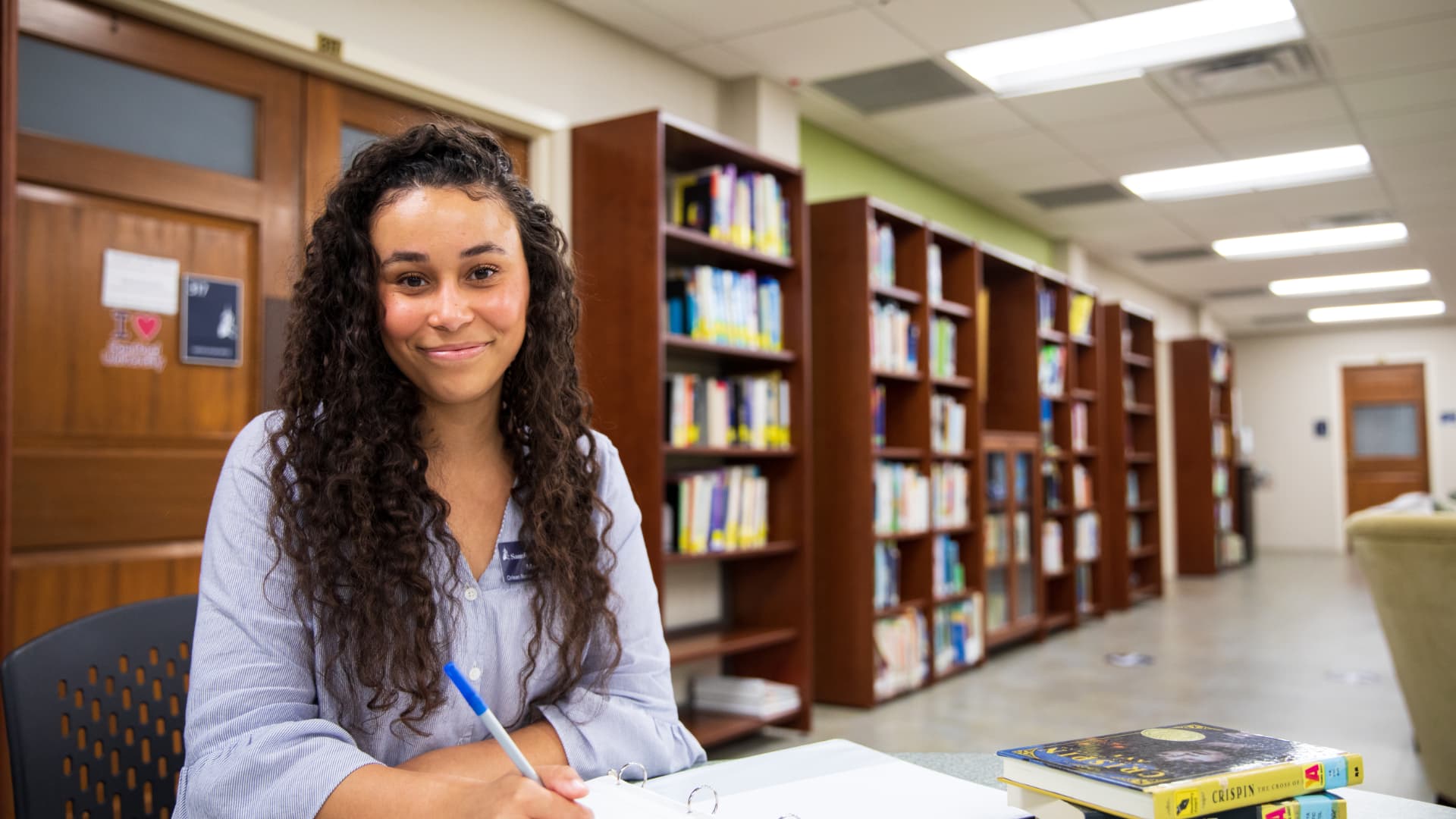 student in library