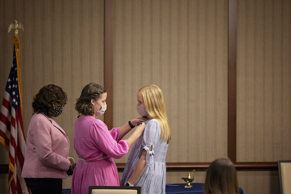 Student Receiving Lamp of Learning