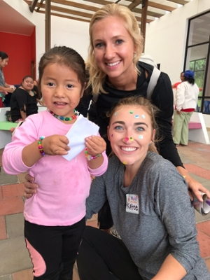 Students with little girl in Ecuador