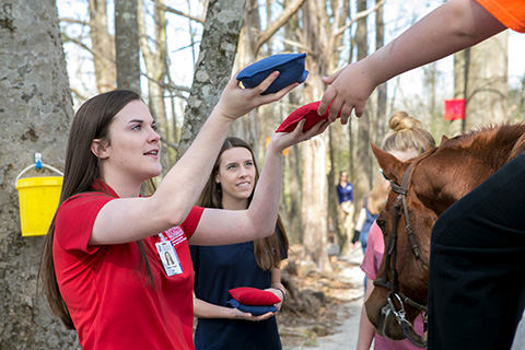 student outside with horse