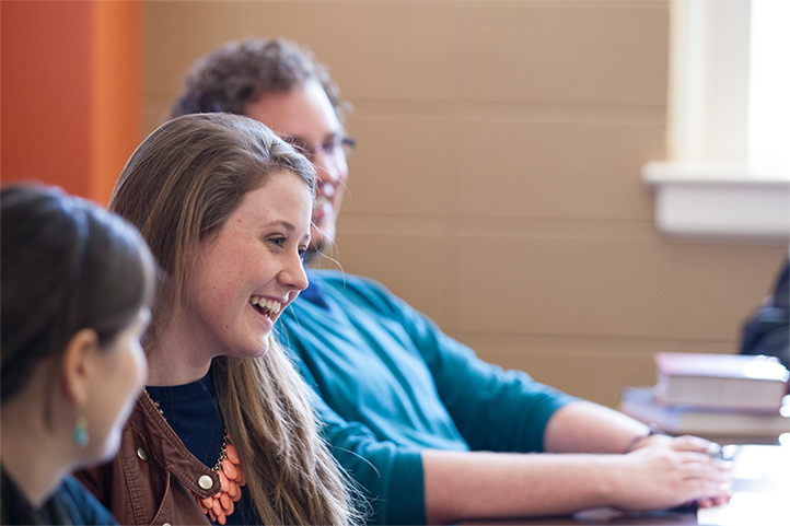 photo of student enjoying classroom discussion