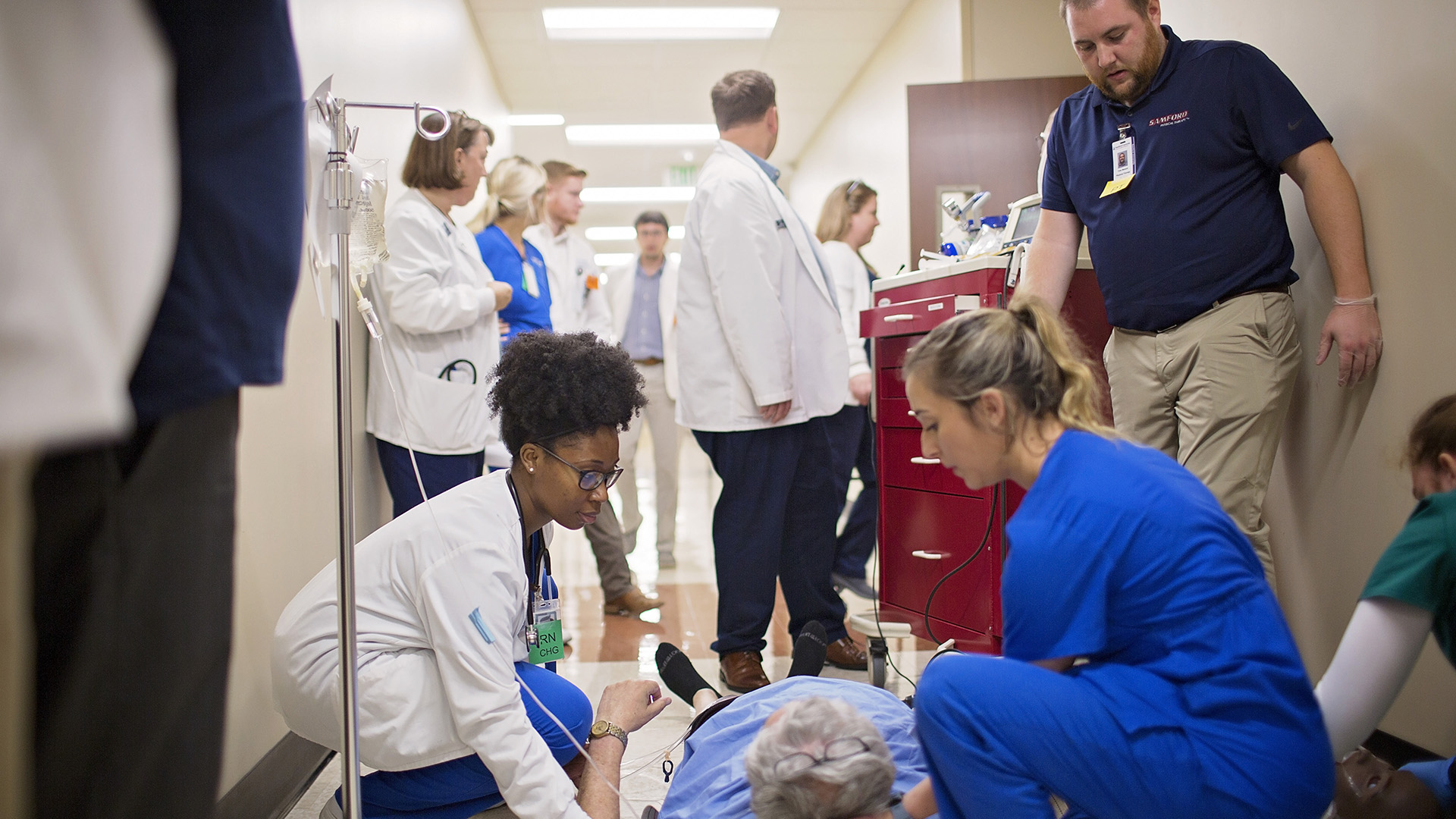 Students participating in a simulation of cardiac arrest. 