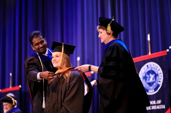 public health student receives hood