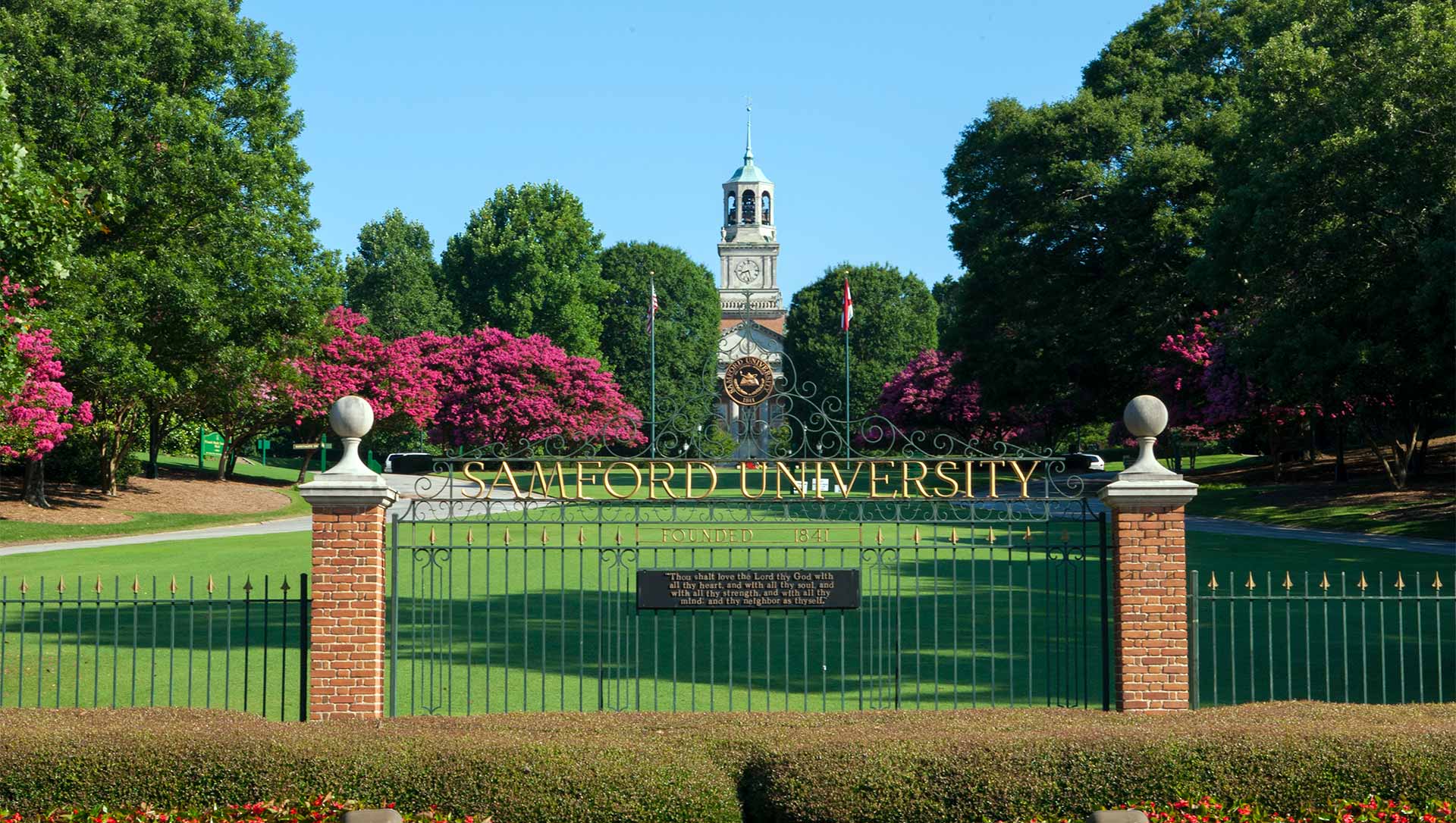 Front Gates With Pink Trees Header