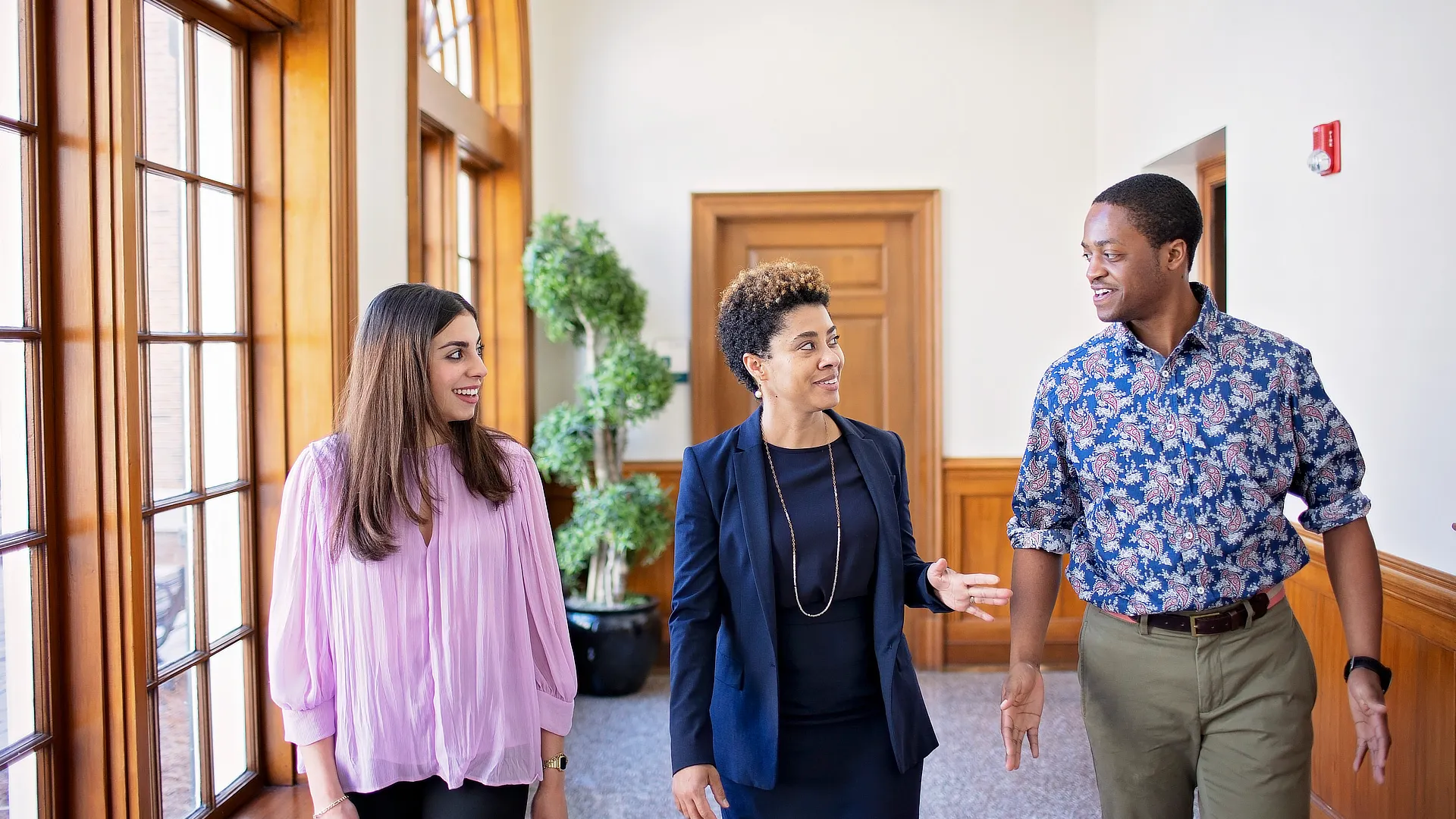 law professor walking with two students