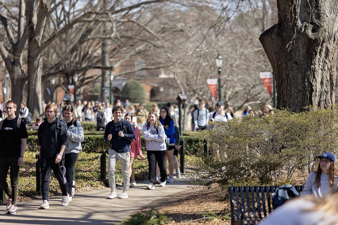 Samford students walk through the Quad