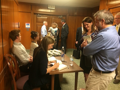 Margaret Wrinkle signs copies of her novel Wash