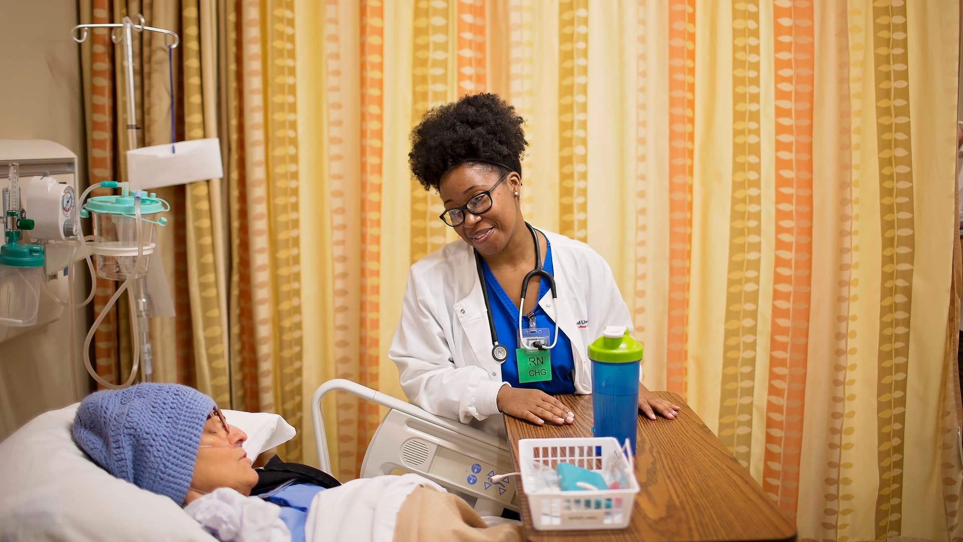 Nurse Tending Sleeping Patient