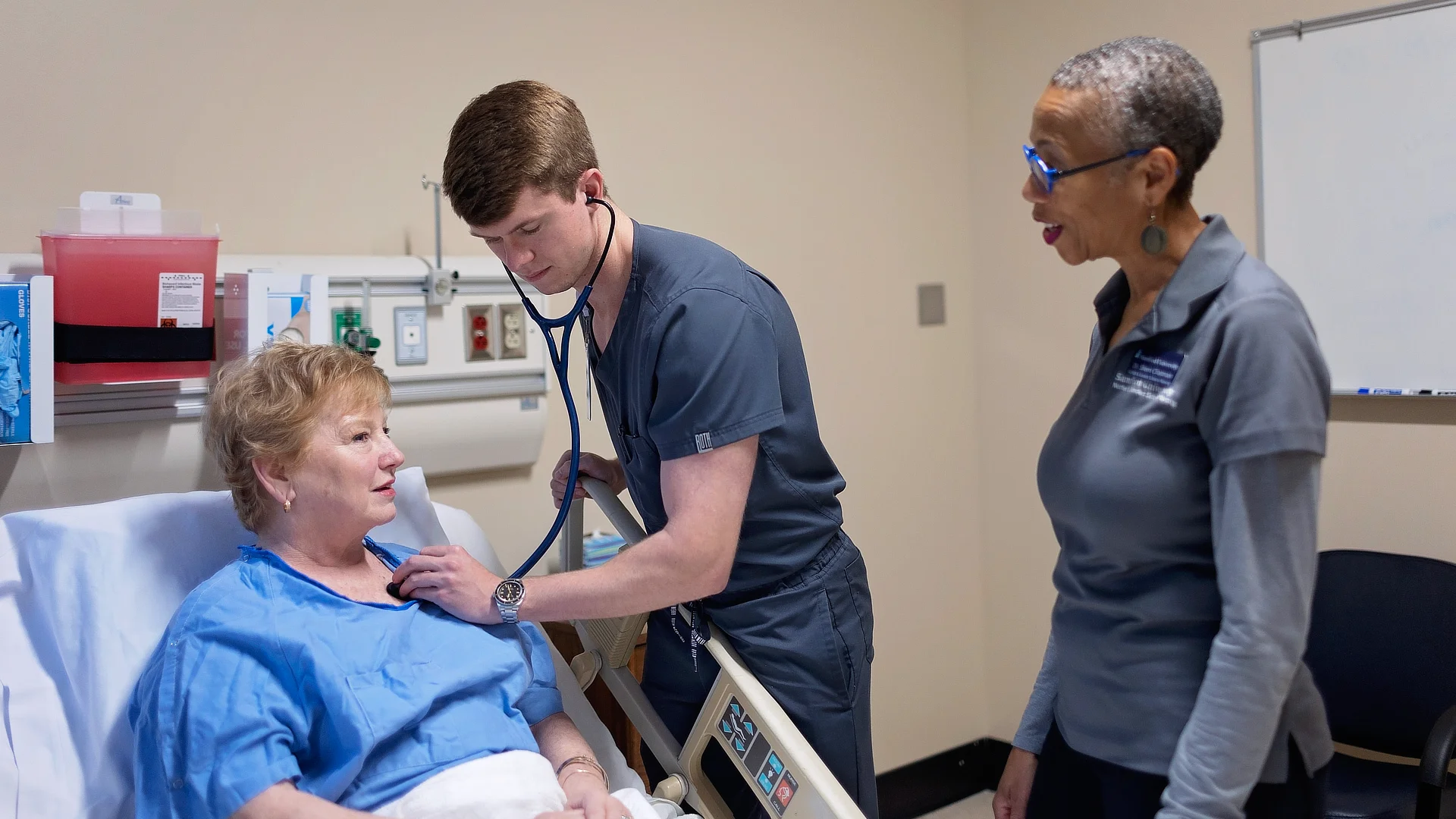 Student and Professor with Patient