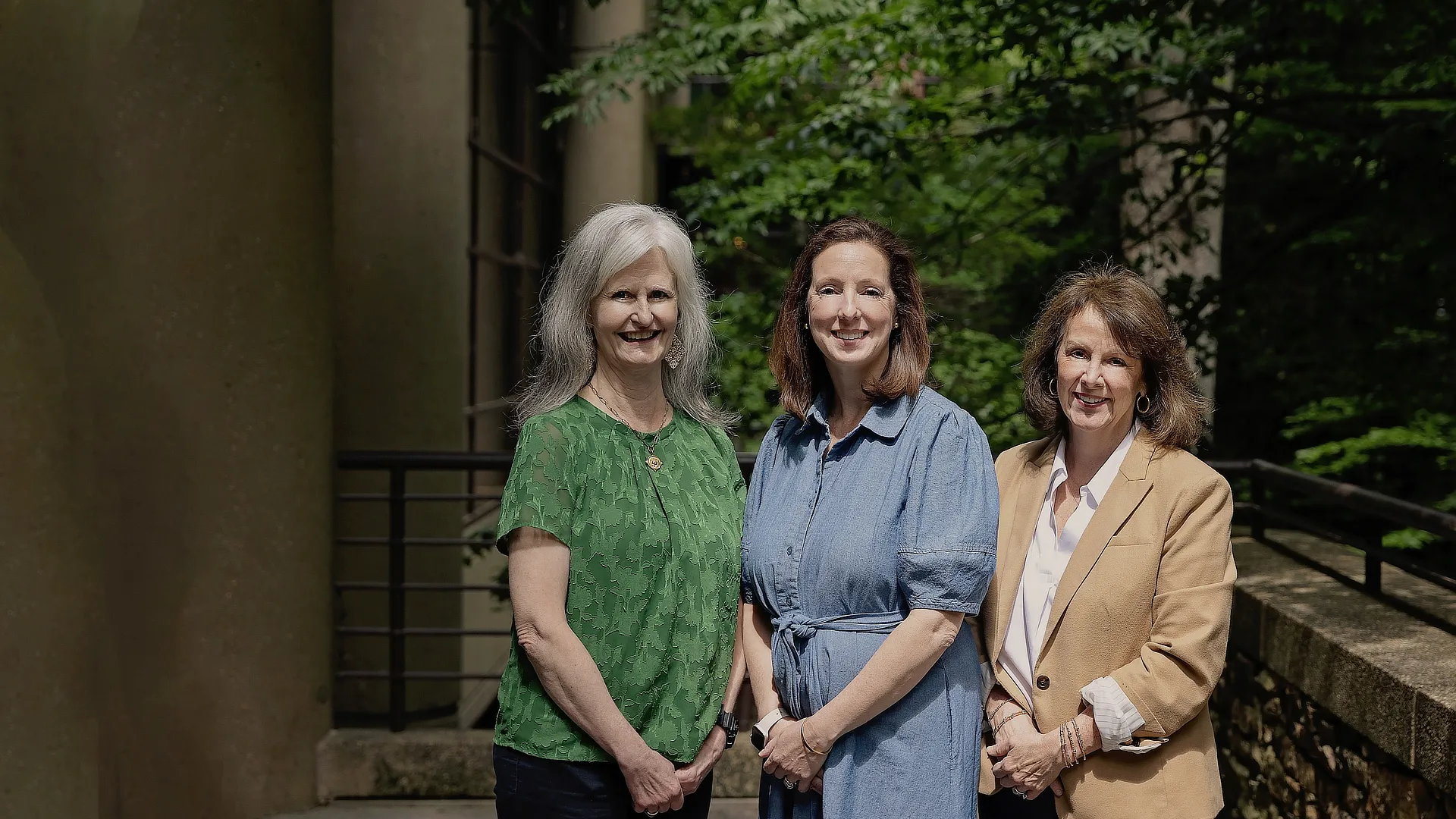 three advisors standing outside