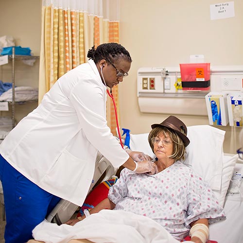 nursing student adjusting breathing tube