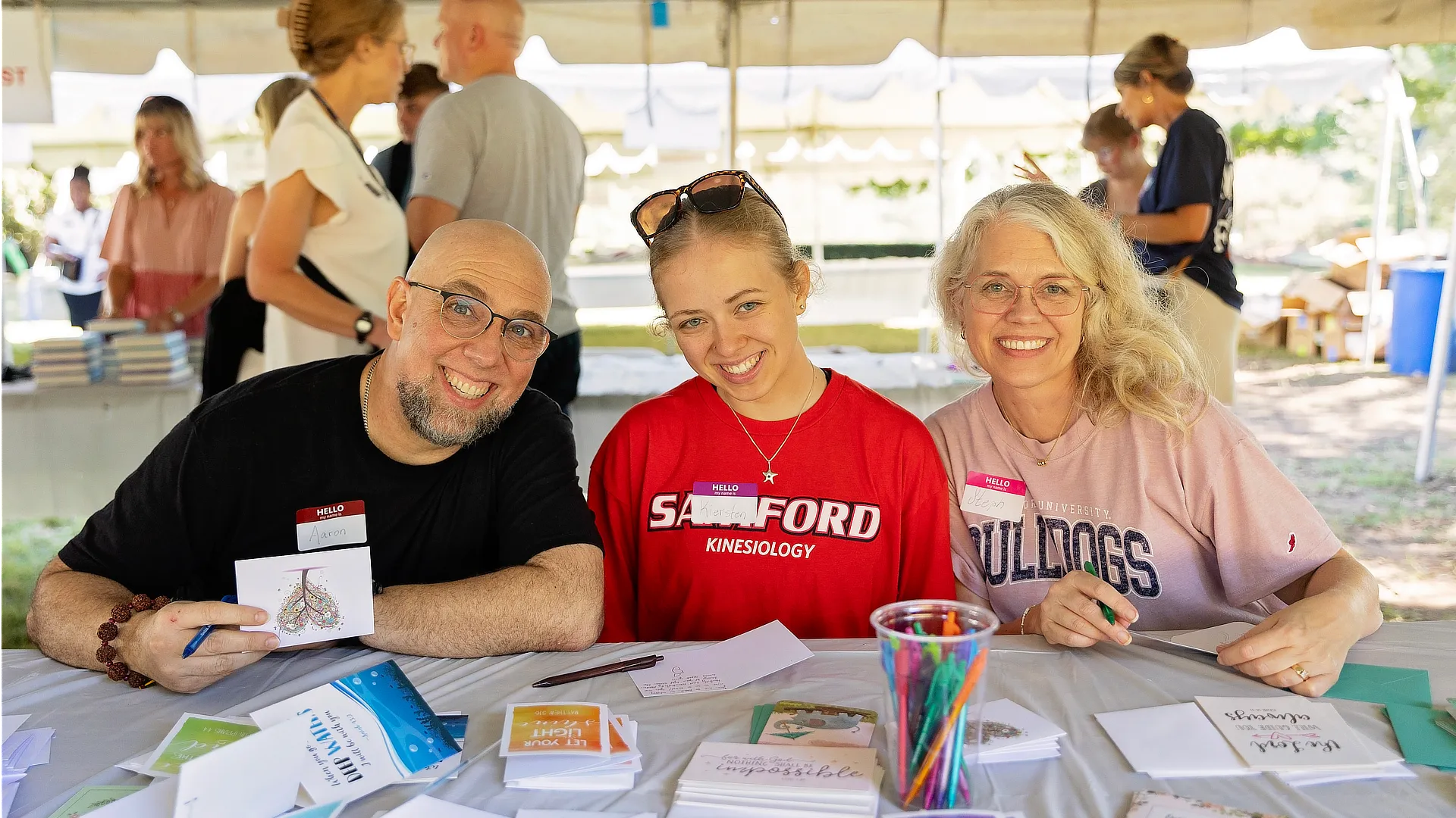student sitting with parents