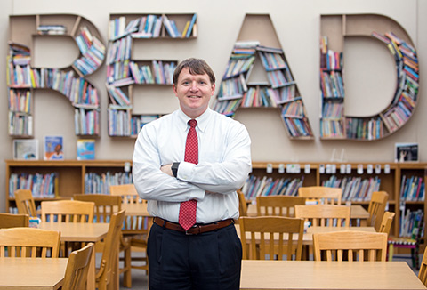 education alumni in library