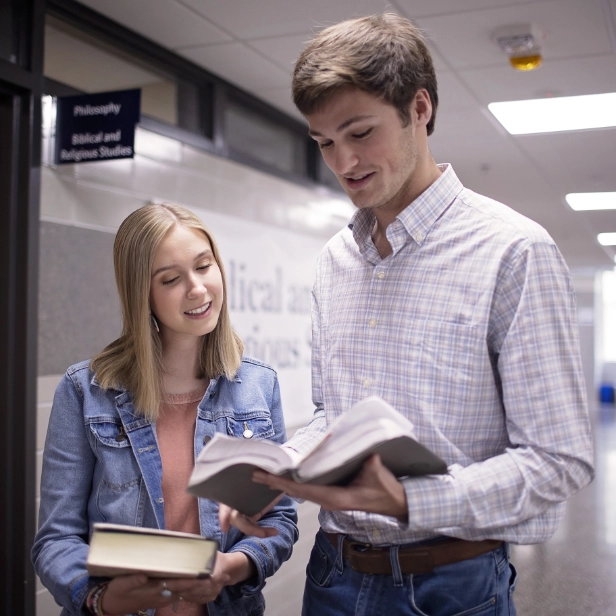 male and female student in hall