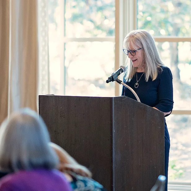 Anna McEwan at podium