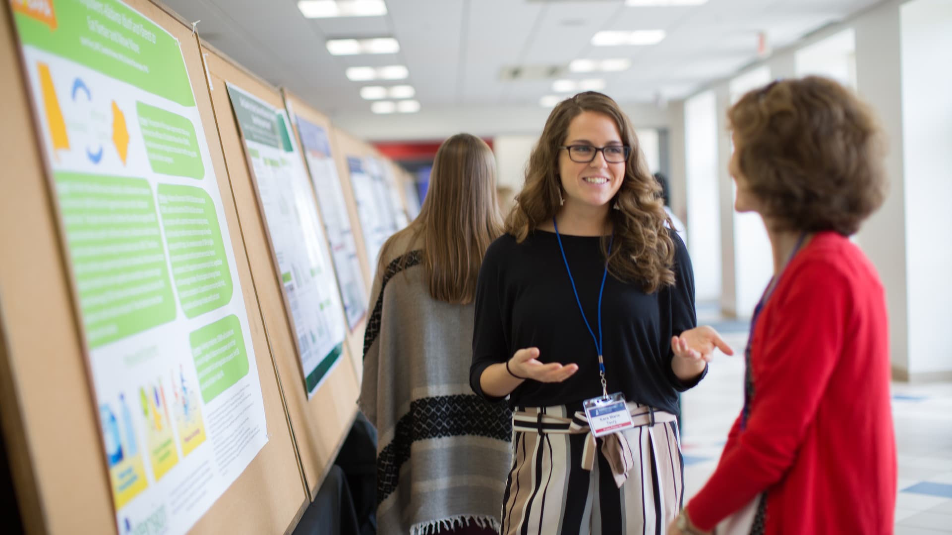 female student explaining research