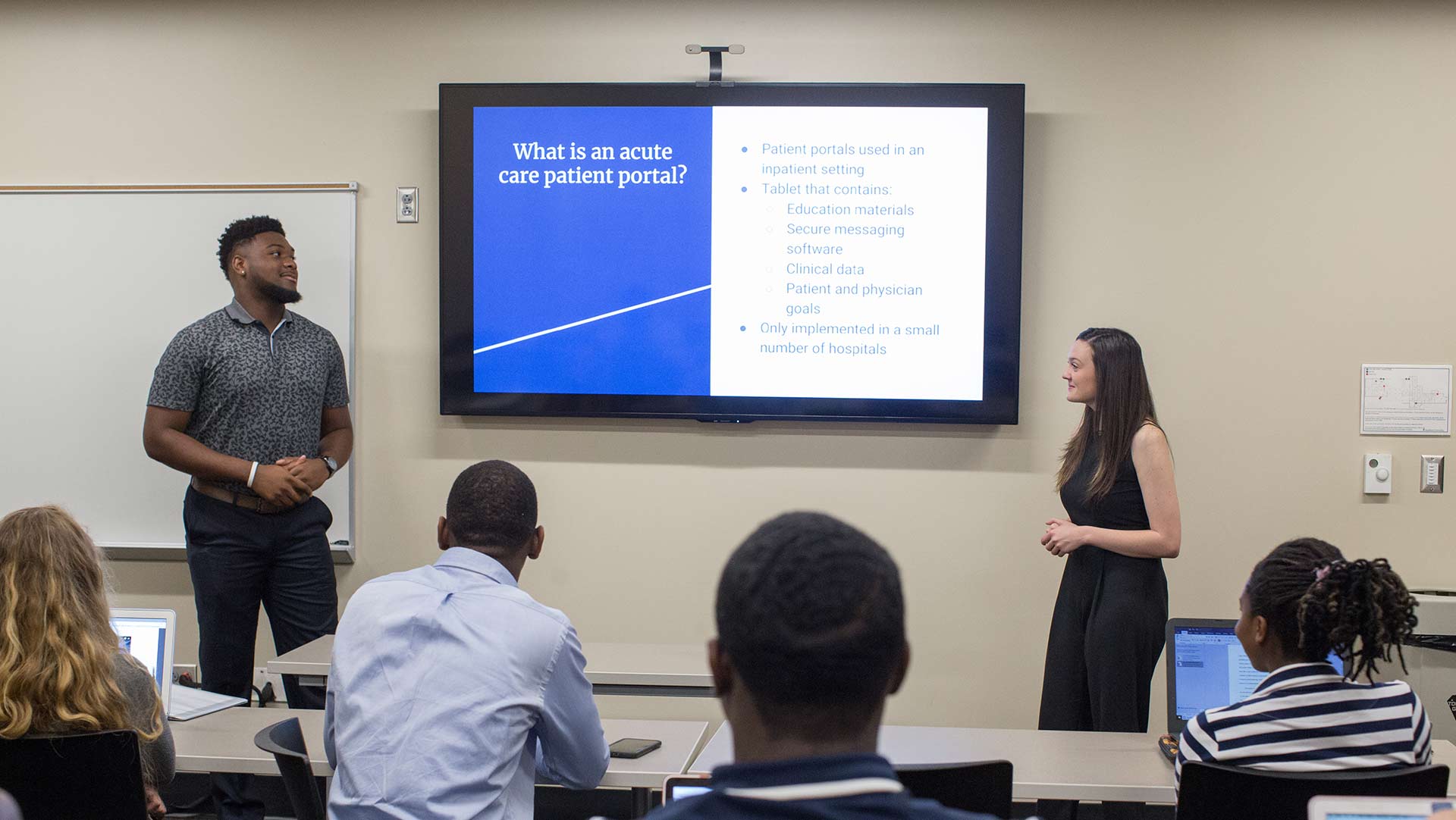 male and female students doing presentation