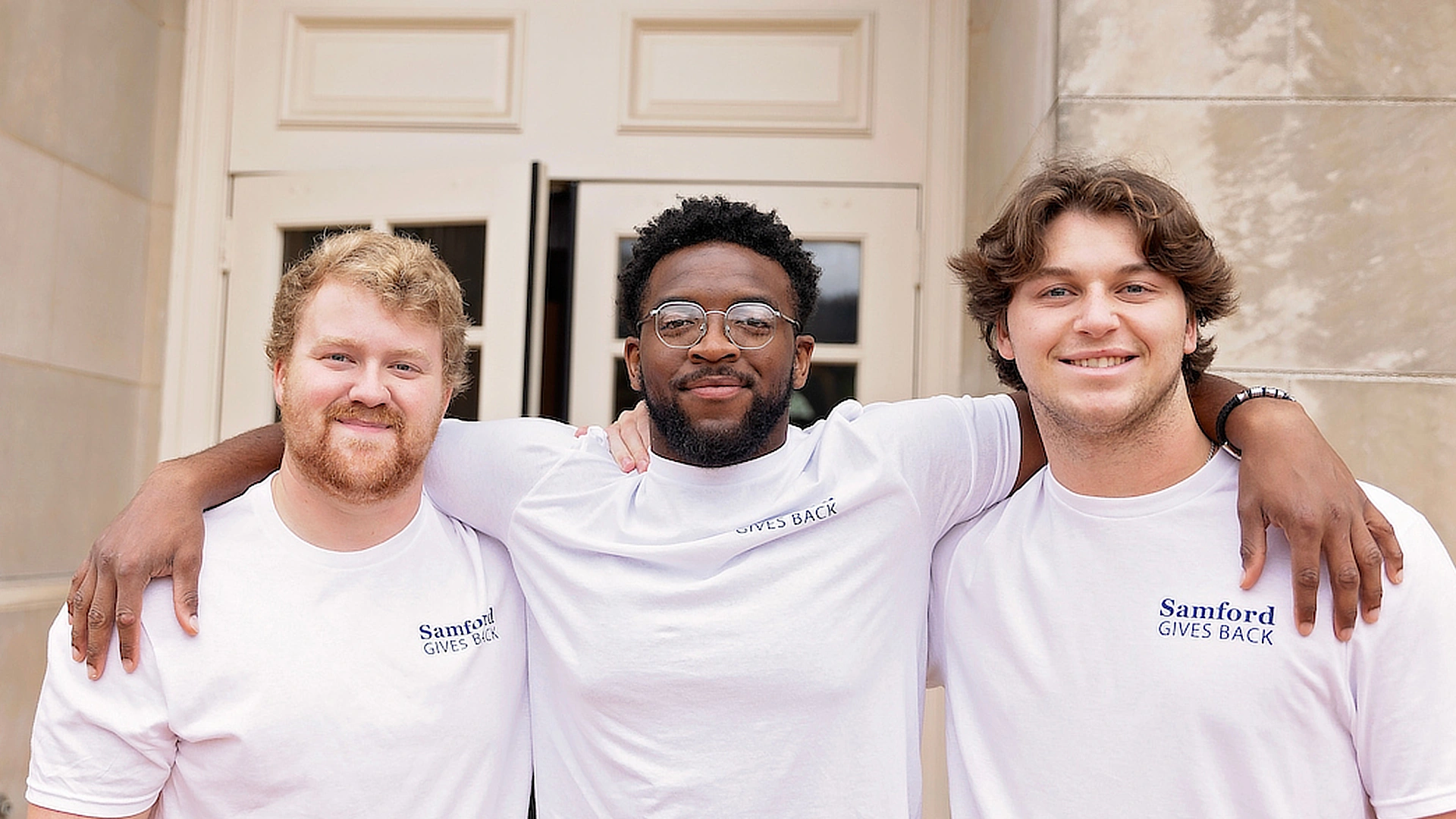 three male students at samford gives back day 2024