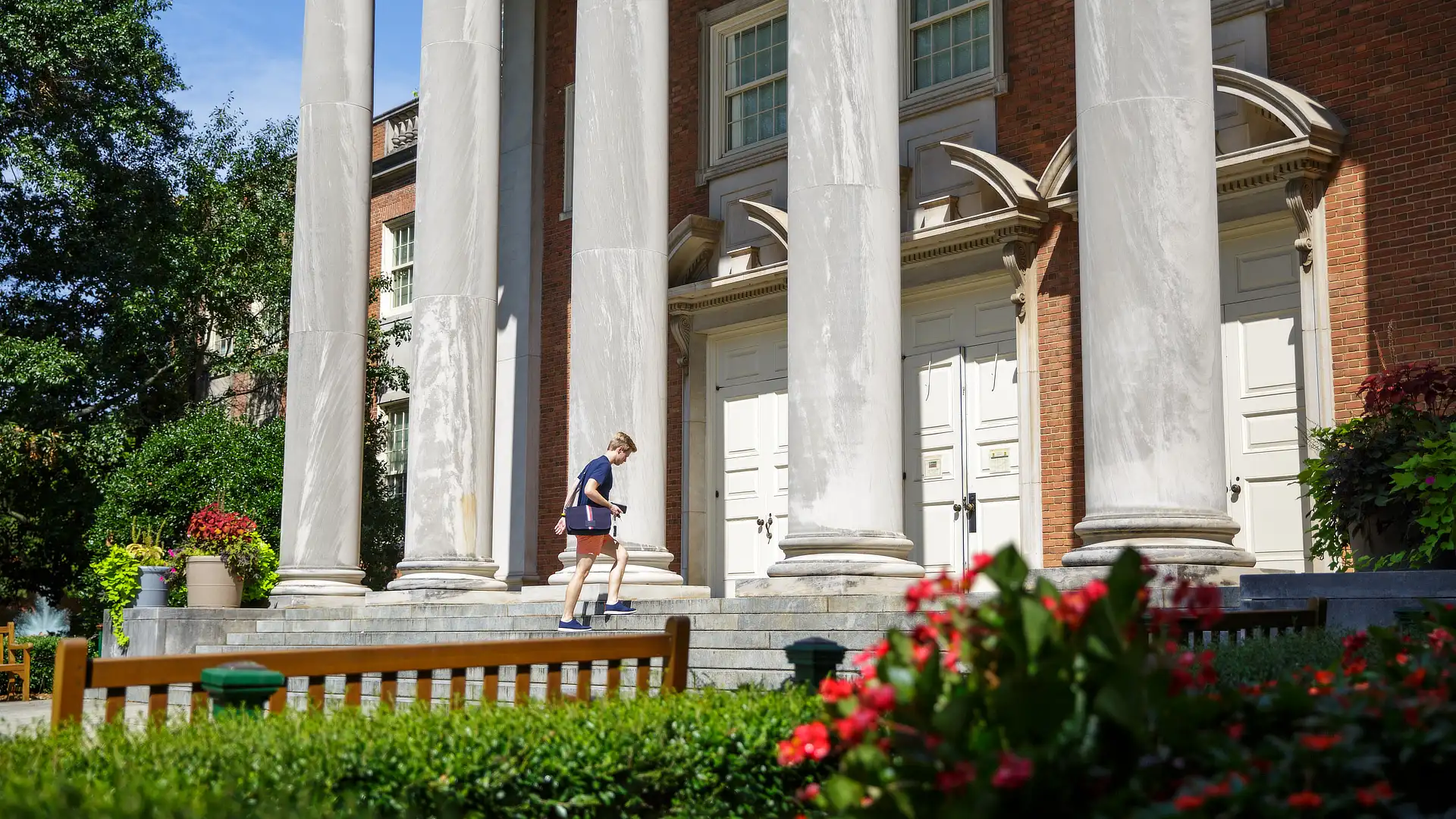 University Fellow Walking Into Library