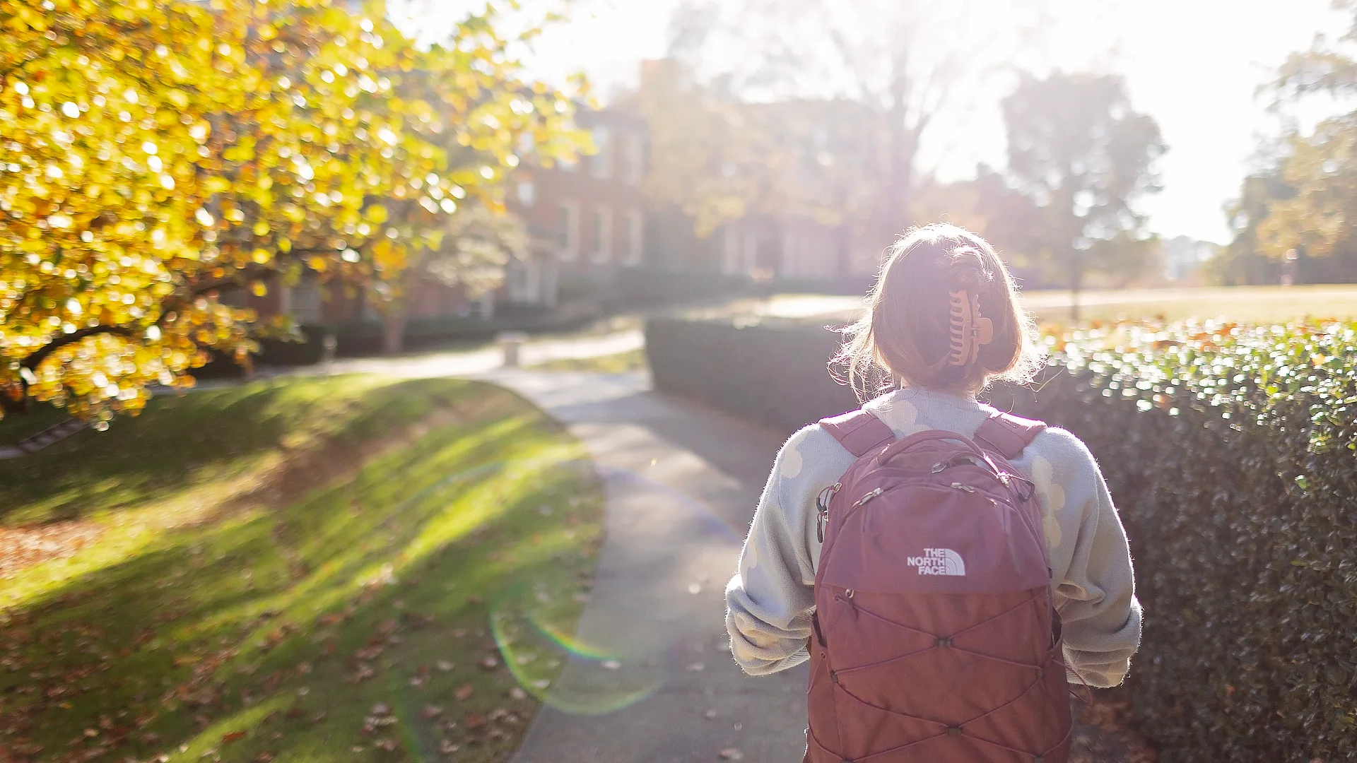 female student walking in quad DR11072023639