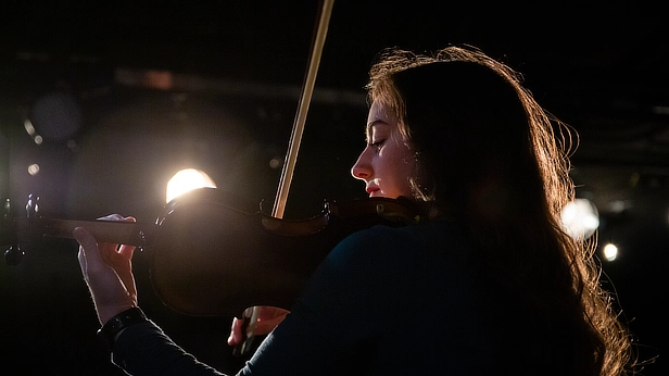 female violin player on stage